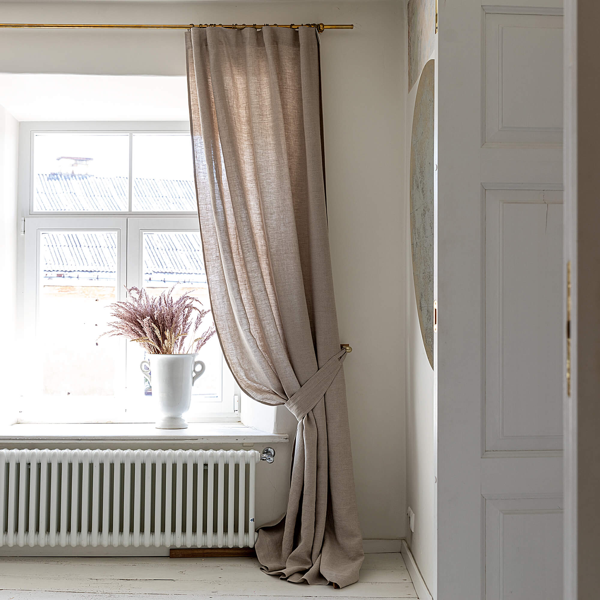 Our natural unbleached linen curtain tie-back is the perfect solution for keeping your curtains looking neat and stylish. Made from the highest-quality European linen, they offer durability and a luxurious feel.