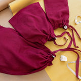Three burgundy linen drawstring gift bags