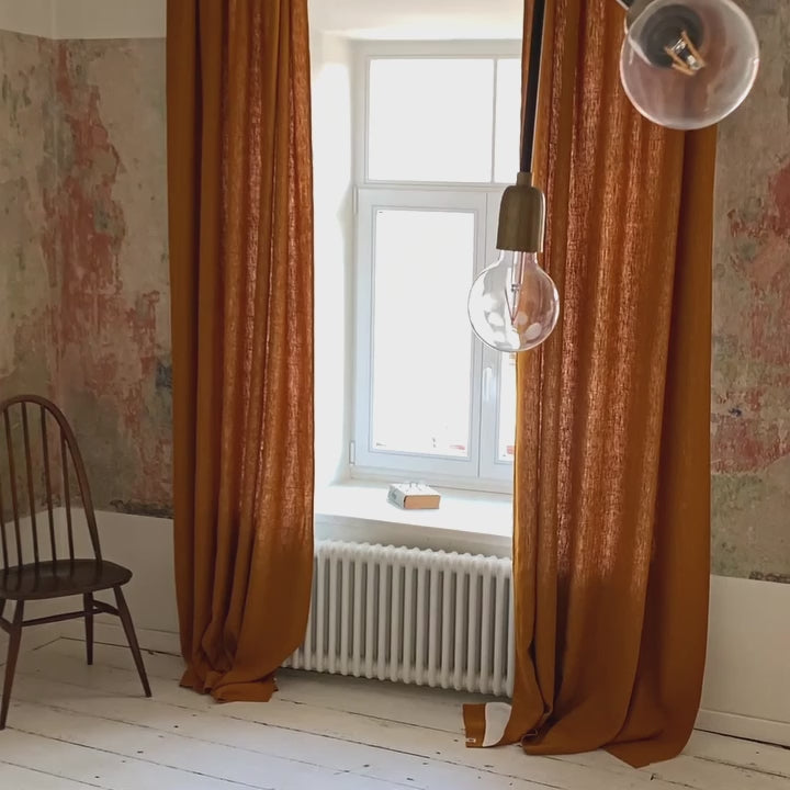 Lined amber yellow linen curtains with lining, designed to provide maximum protection from the sun and heat coming through the window. Natural thermoregulatory properties of linen will help you to create the most comfortable atmosphere at home.