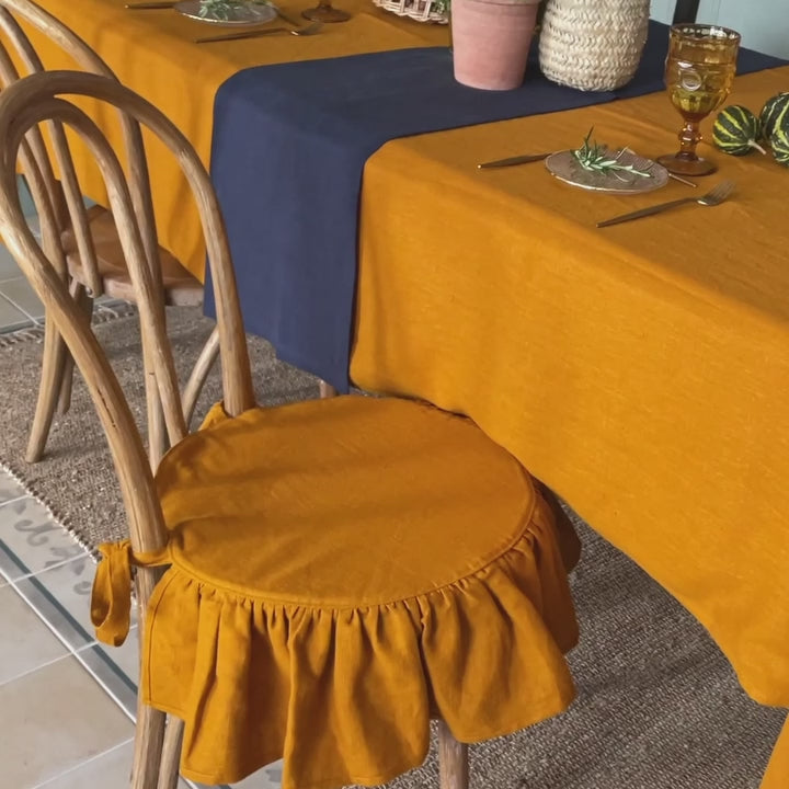 Our amber yellow linen ruffled chair slipcovers offer both practicality and aesthetic appeal. The covers will protect dining chairs from spills and stains, also enhance the visual appeal of your space with their timeless natural style. Slipcovers will simply change your chairs appearance and provide an elegant solution.