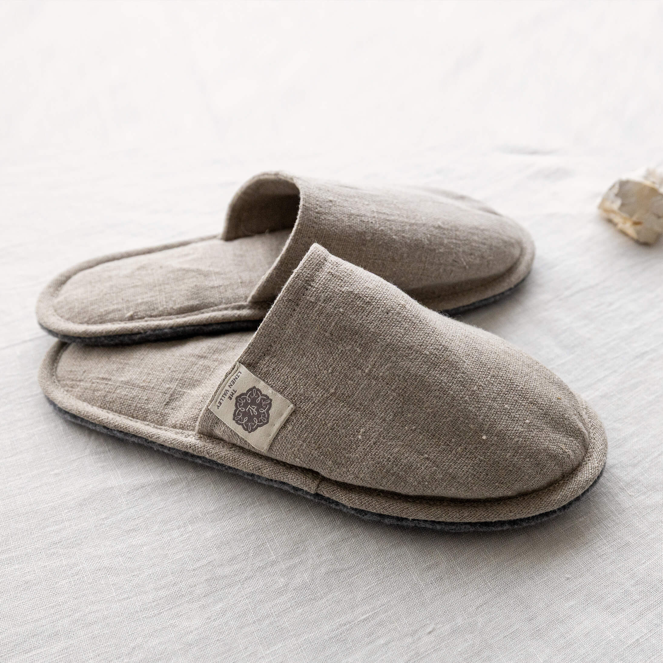 Rustic linen open-back slippers with The Linen Valley label