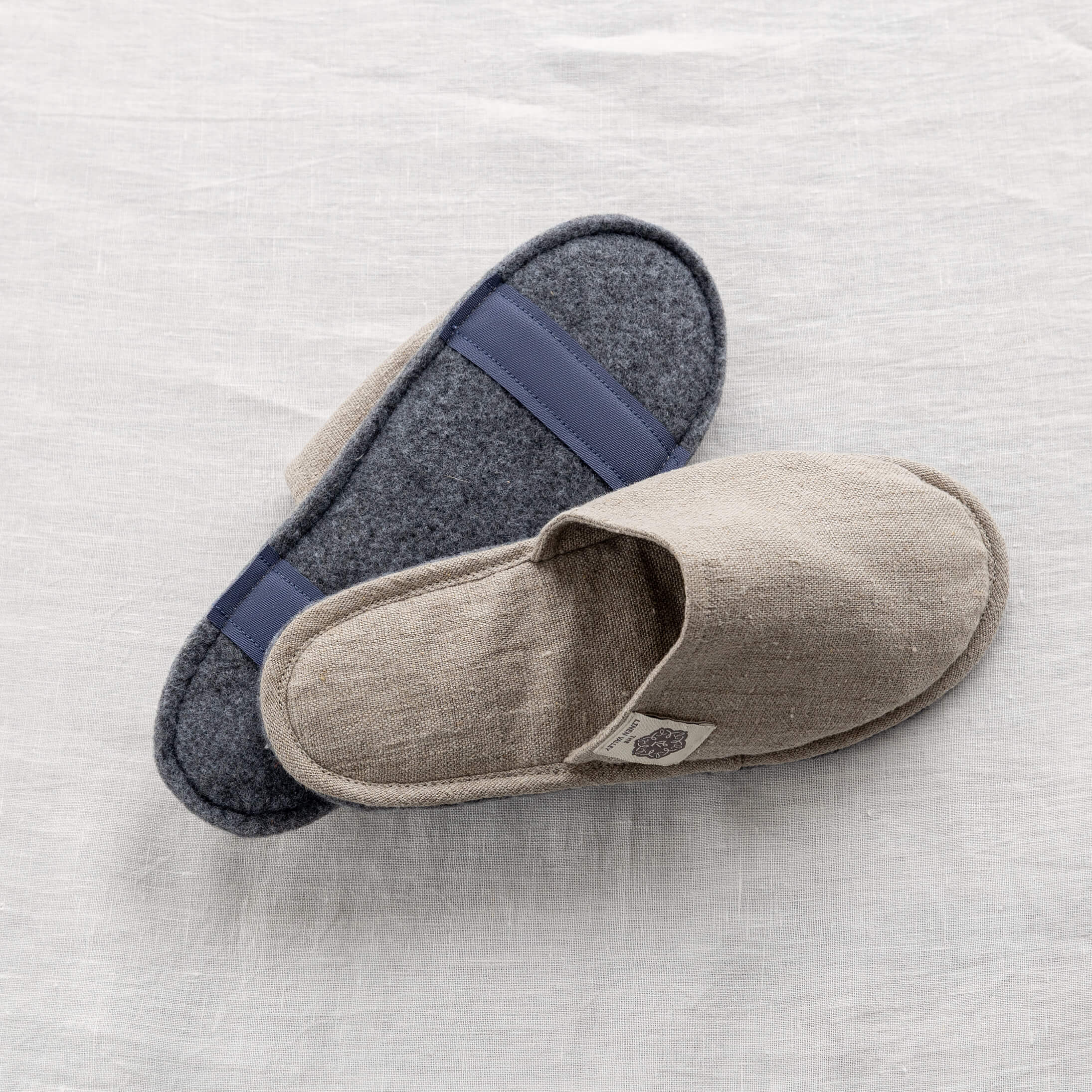Grey felt sole of a rustic linen slipper