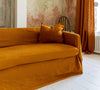 Introducing our Amber Yellow linen couch cover, crafted to enhance the beauty and functionality of your sofa. Designed to shield your couch from daily spills and stains, this cover offers both practicality and elegance.