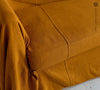 Introducing our Amber Yellow linen couch cover, crafted to enhance the beauty and functionality of your sofa. Designed to shield your couch from daily spills and stains, this cover offers both practicality and elegance.
