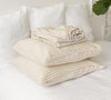 Transform your bedroom into a serene oasis with our exquisite linen sheet set in white and natural stripes.