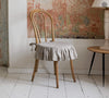 Our linen slipcovers offer both practicality and aesthetic appeal. The covers will protect dining chairs from spills and stains, also enhance the visual appeal of your space with their timeless natural style. Slipcovers will simply change your chairs' appearance and provide an elegant solution.